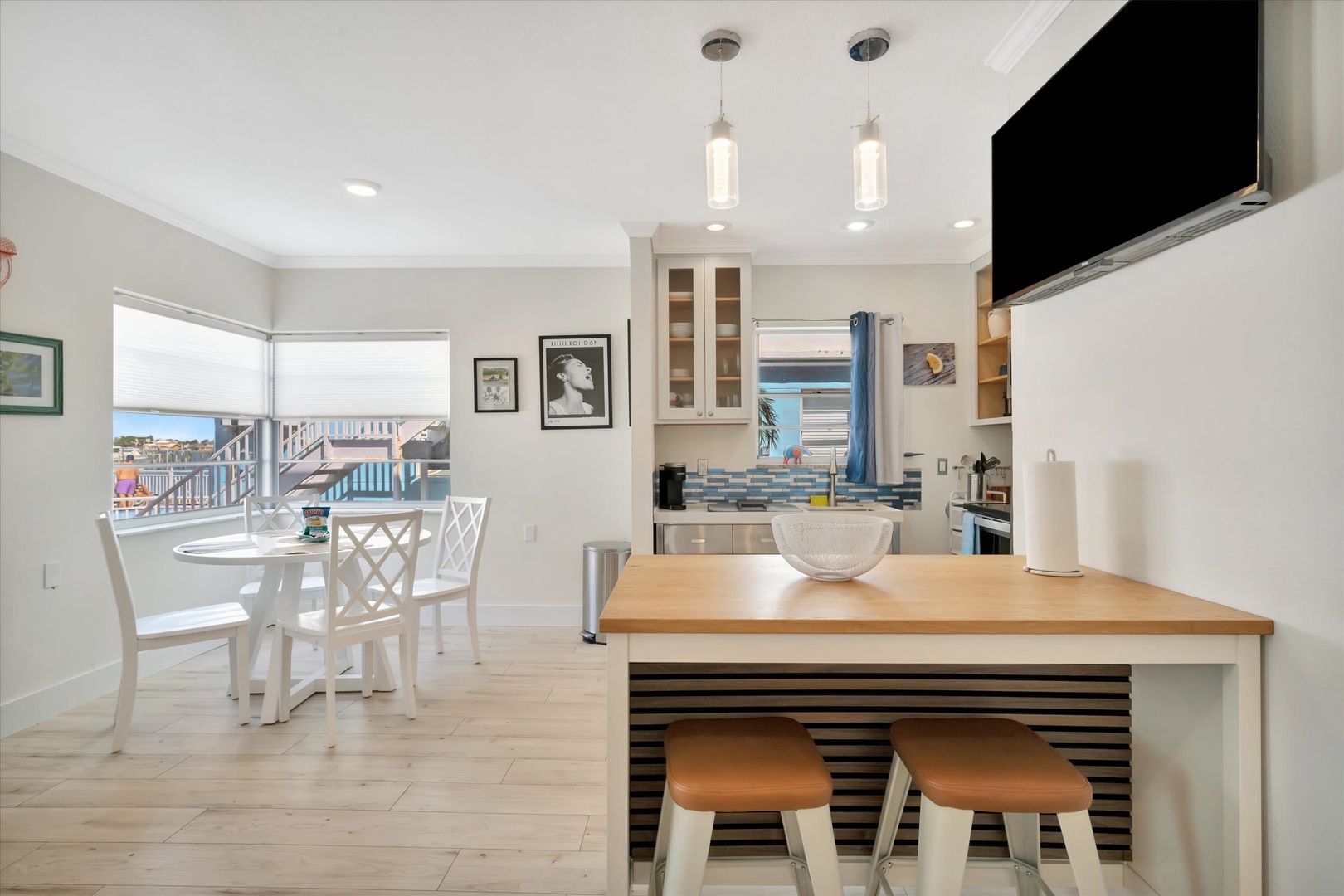 Bright, open living space where you can prepare meals at the island while enjoying the coastal lifestyle. Step through the door to your private balcony overlooking the ocean.