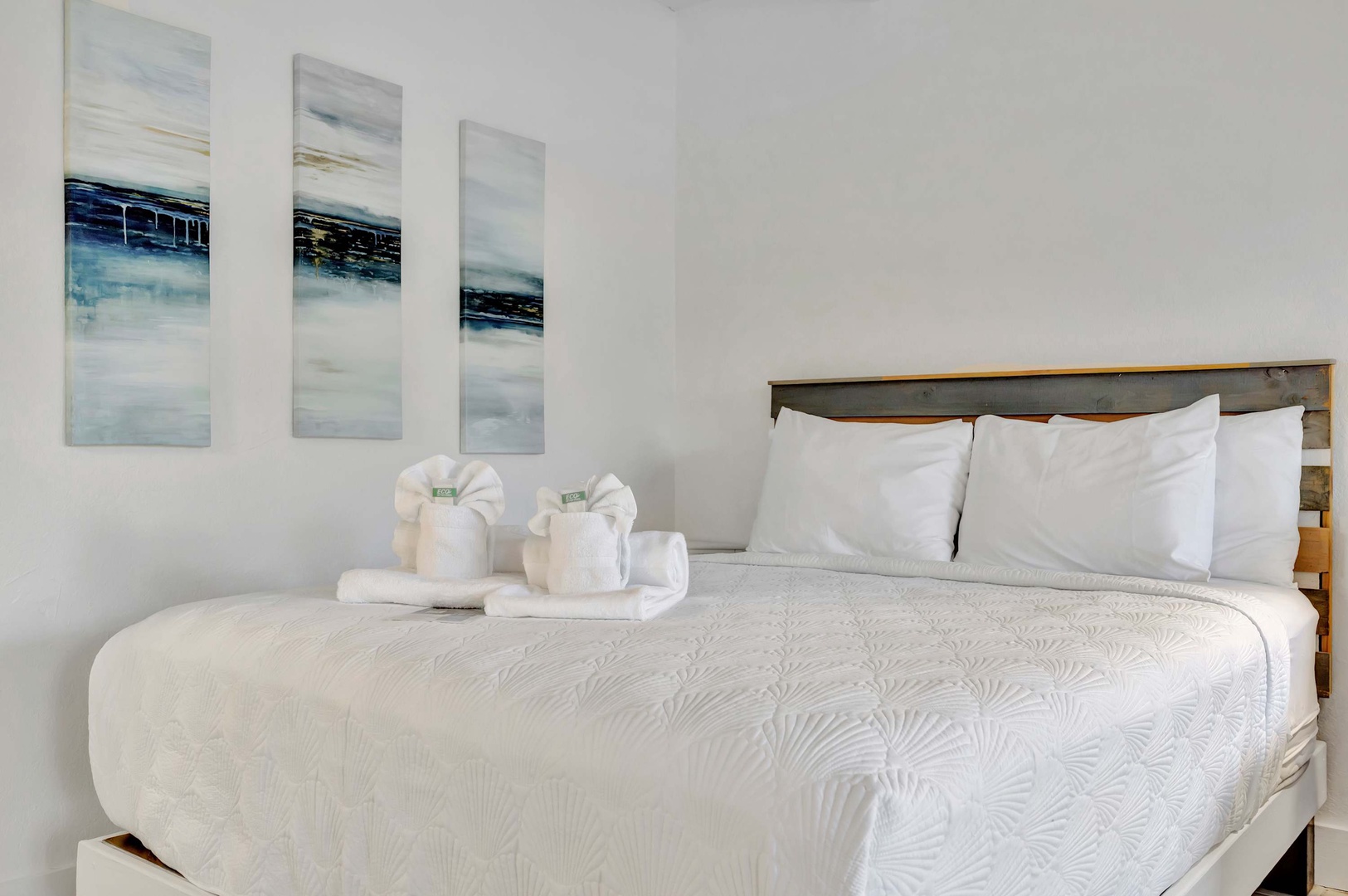 Sink into crisp linens and plush pillows after a day of adventure. Your serene bedroom awaits, complete with thoughtful touches like decorative towel swans to make you smile.