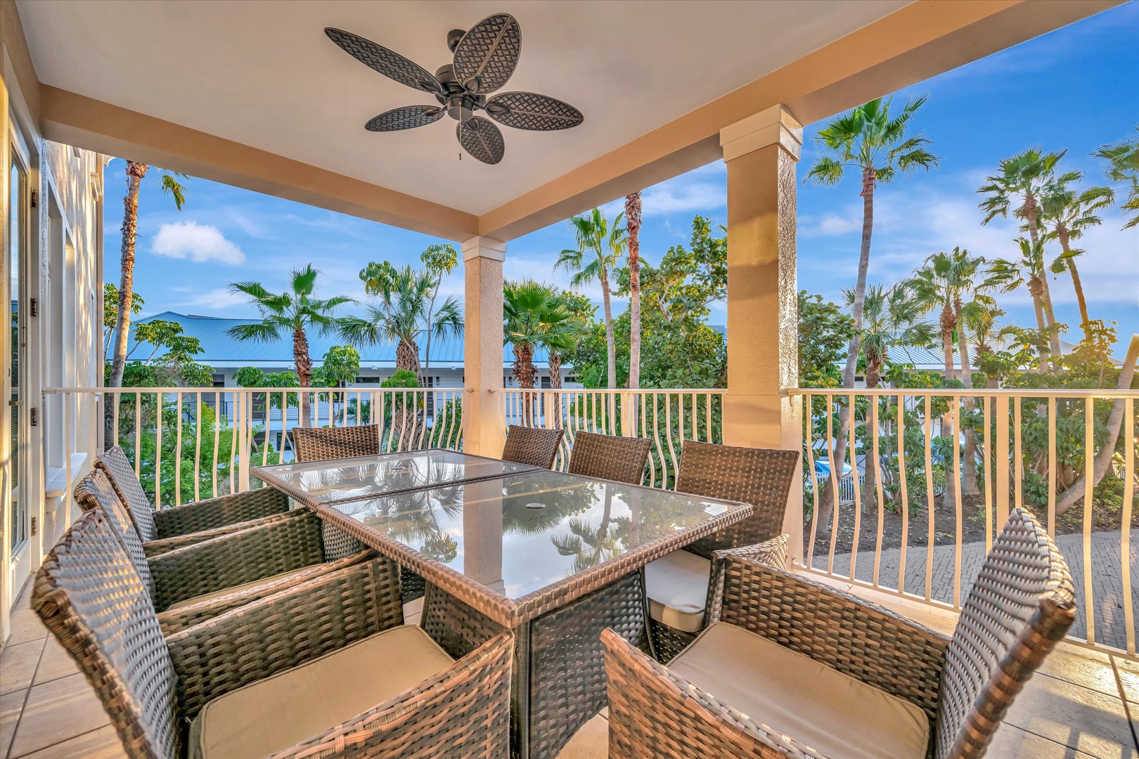 Gather around your private terrace for meals under swaying palms, with tropical breezes from the ceiling fan and stunning ocean views framing every moment.