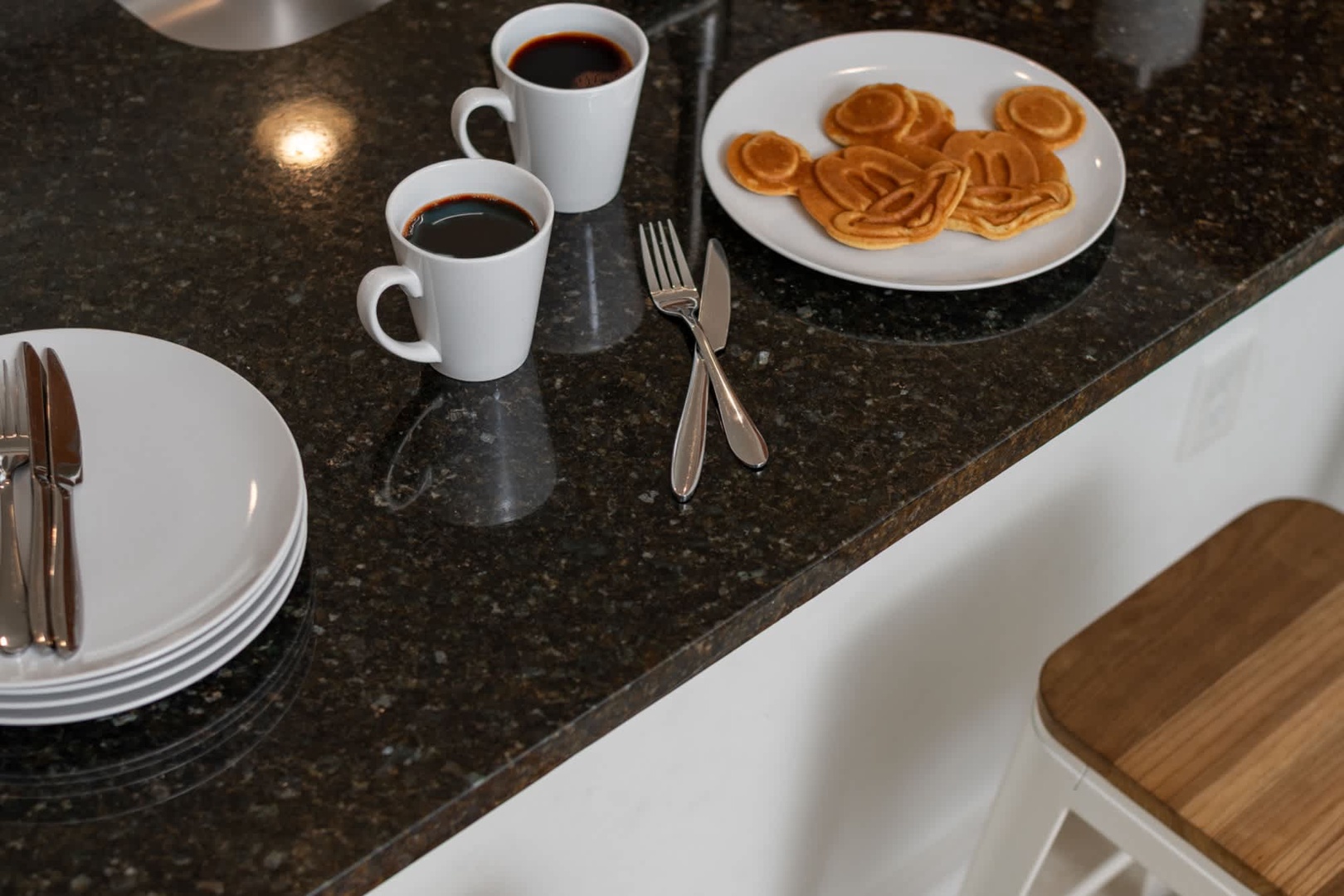 Start your mornings right with fresh coffee and whimsical waffles at the granite breakfast bar—your perfect spot to fuel up for the day's adventures.