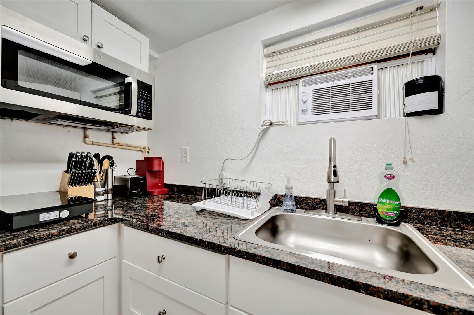 Your kitchen is equipped with everything you need, from cookware and appliances to a modern workspace with granite counters, making meal prep easy and enjoyable.
