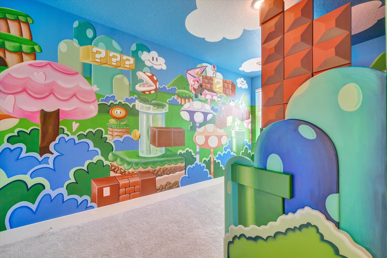 This imaginative gaming-themed room features vibrant murals perfect for kids and families who love playful adventures. The custom artwork creates a fun, immersive space where young guests can let their imaginations run wild.