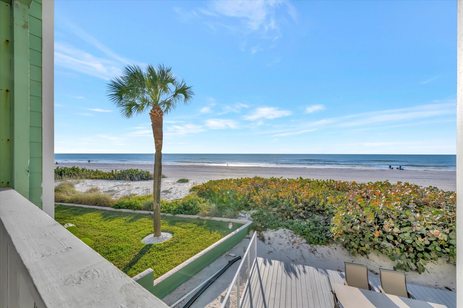 Step outside to your private balcony where ocean breezes and endless blue horizons await. This beachfront escape offers direct access to pristine white sands and gentle waves—your perfect coastal retreat.