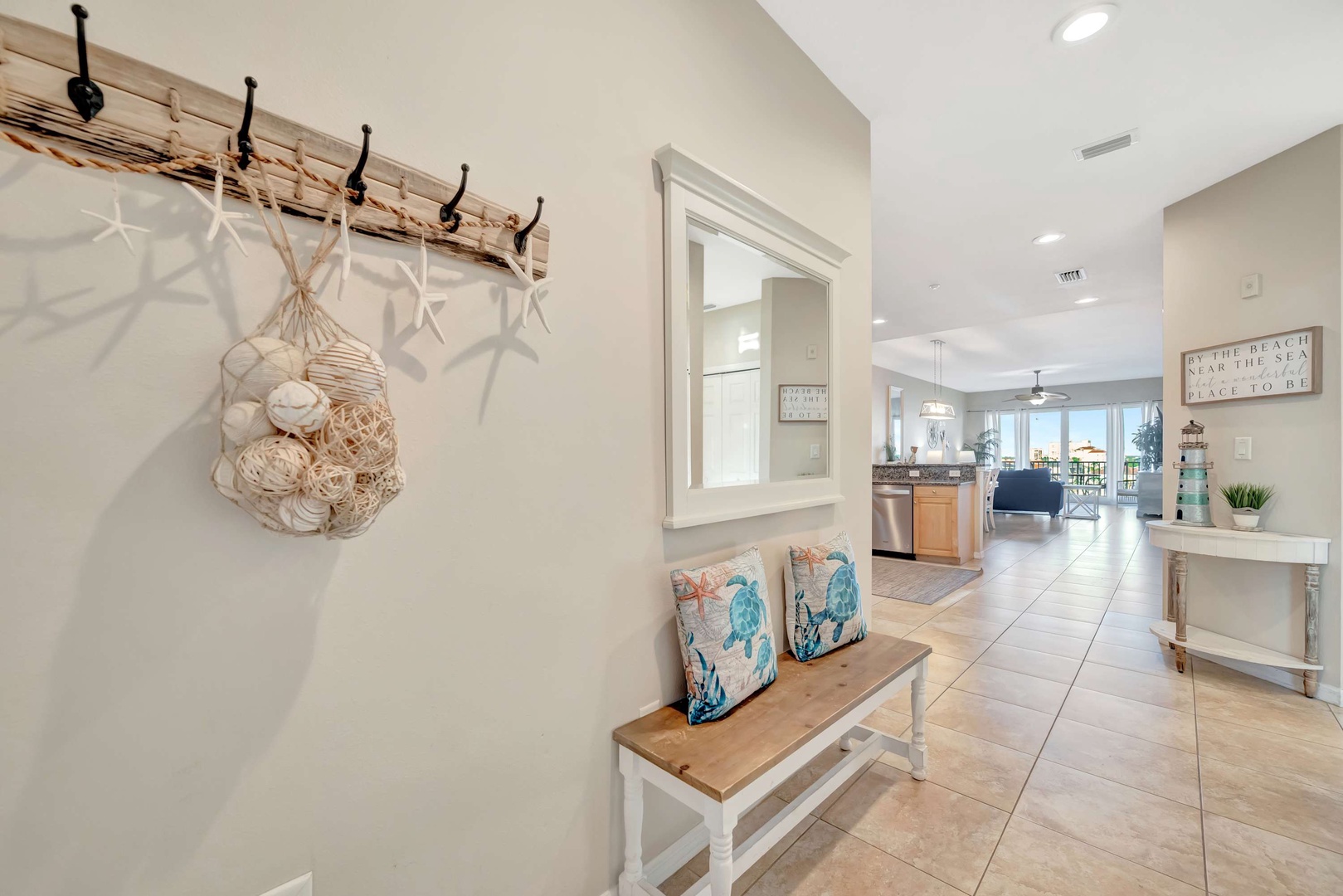 Step into your coastal retreat where beach-inspired decor and bright, open spaces welcome you home, setting the tone for relaxation from the moment you arrive.