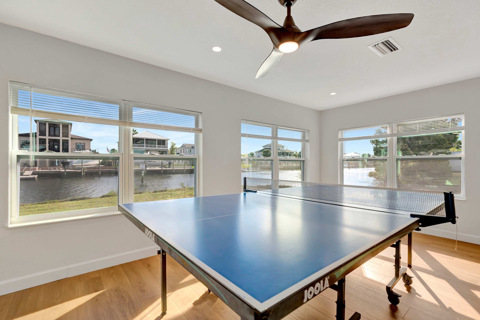 Challenge your friends to a friendly match while soaking in peaceful water views—your perfect blend of fun and relaxation awaits.