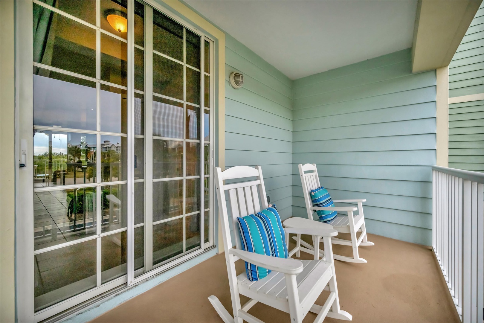 Sink into these cozy rockers on your private balcony, perfect for sipping morning coffee or unwinding as the day slips away in peaceful comfort.