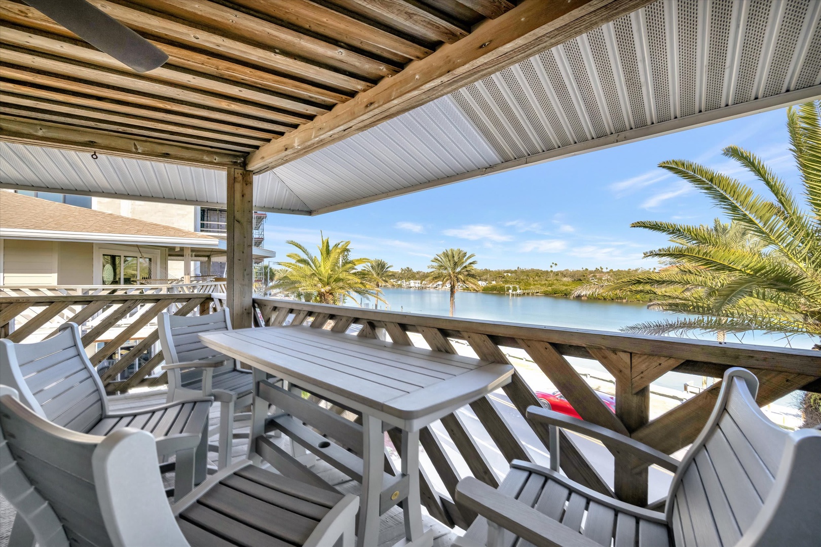 Step onto your private covered terrace and let the tranquil water views wash over you. With comfortable seating and gentle palm breezes, this is your perfect spot for morning coffee or sunset reflections.