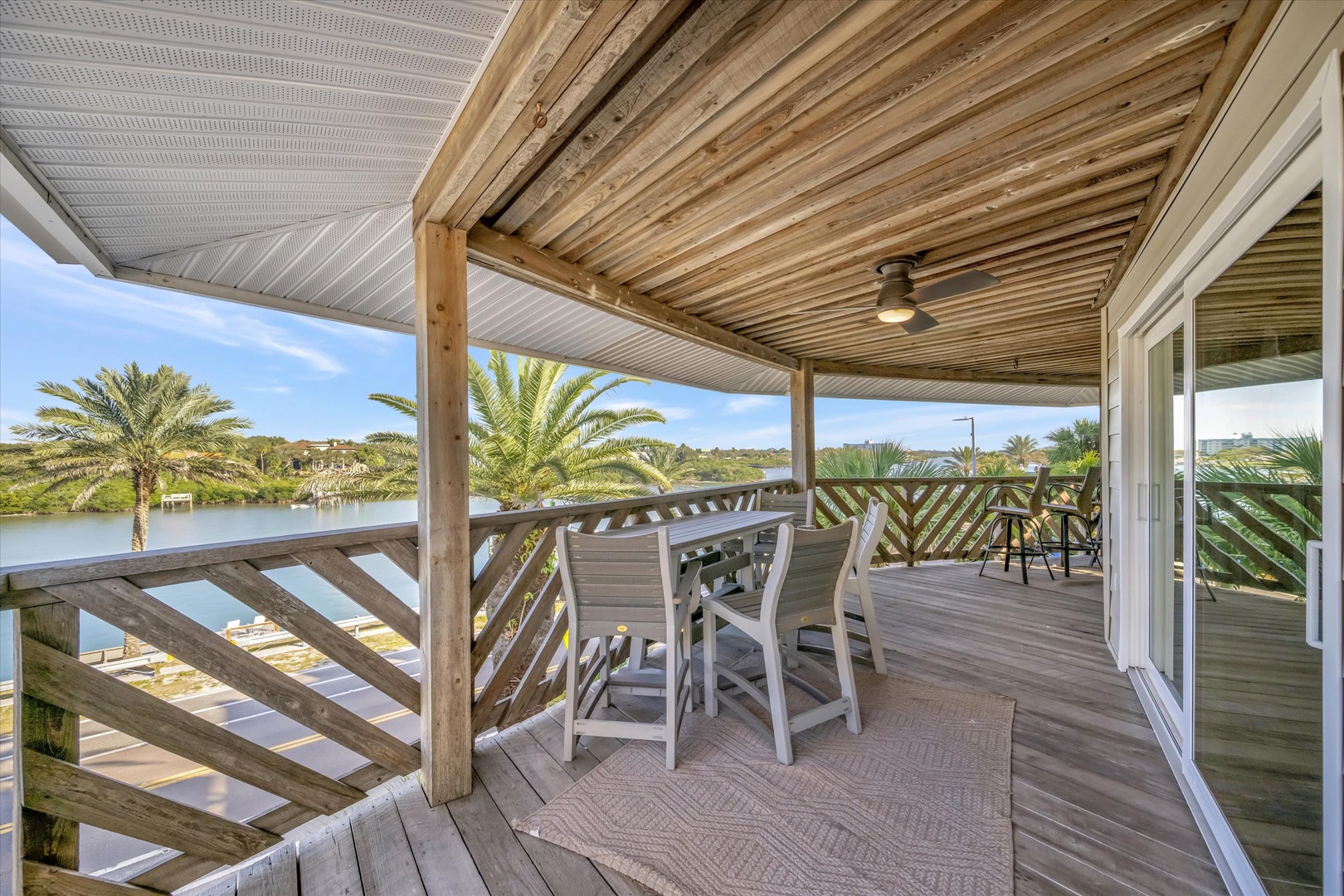 Step onto your private waterfront deck where palm trees sway and peaceful water views create the perfect setting for your morning coffee or evening unwind.