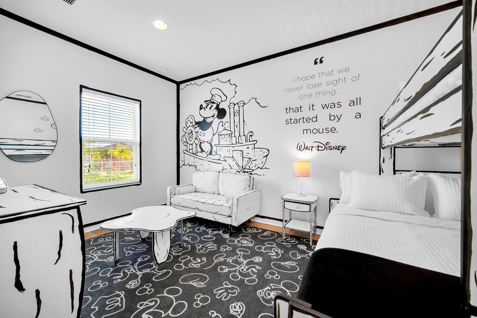 Step into a whimsical Disney-inspired retreat where your imagination comes to life. Relax on the stylish sofa or unwind in the comfortable bed, surrounded by playful artwork and a magical quote that reminds you where it all began.