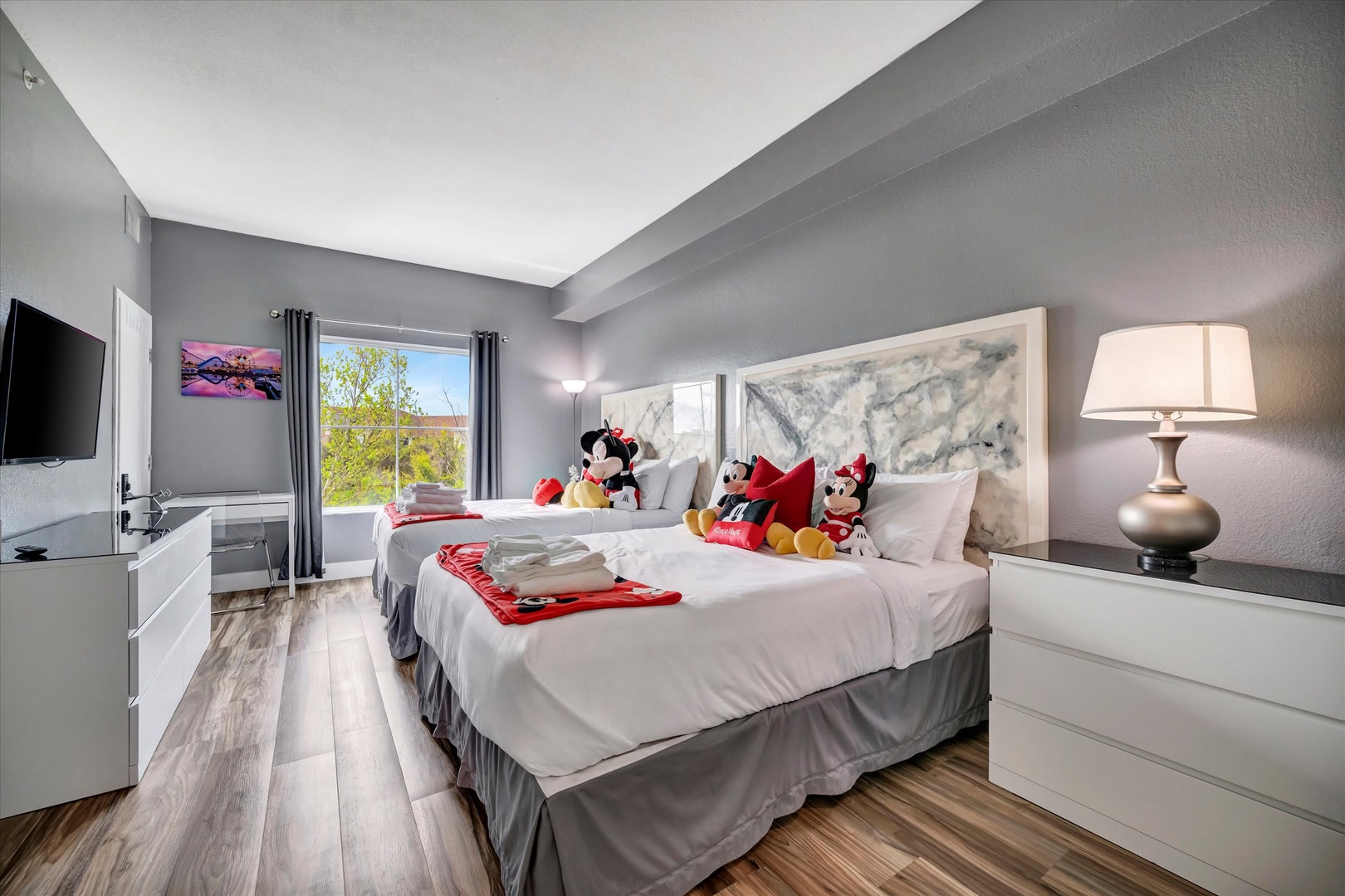 Settle into your peaceful bedroom retreat with plush bedding, soft lighting, and cheerful touches that make your stay feel special. You'll wake to natural light through your window and start each day refreshed.