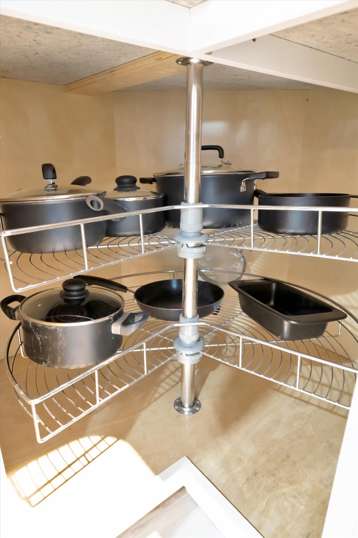A clever revolving corner cabinet organizes your cookware beautifully, with multiple tiers of pots and pans right at your fingertips whenever you need them.