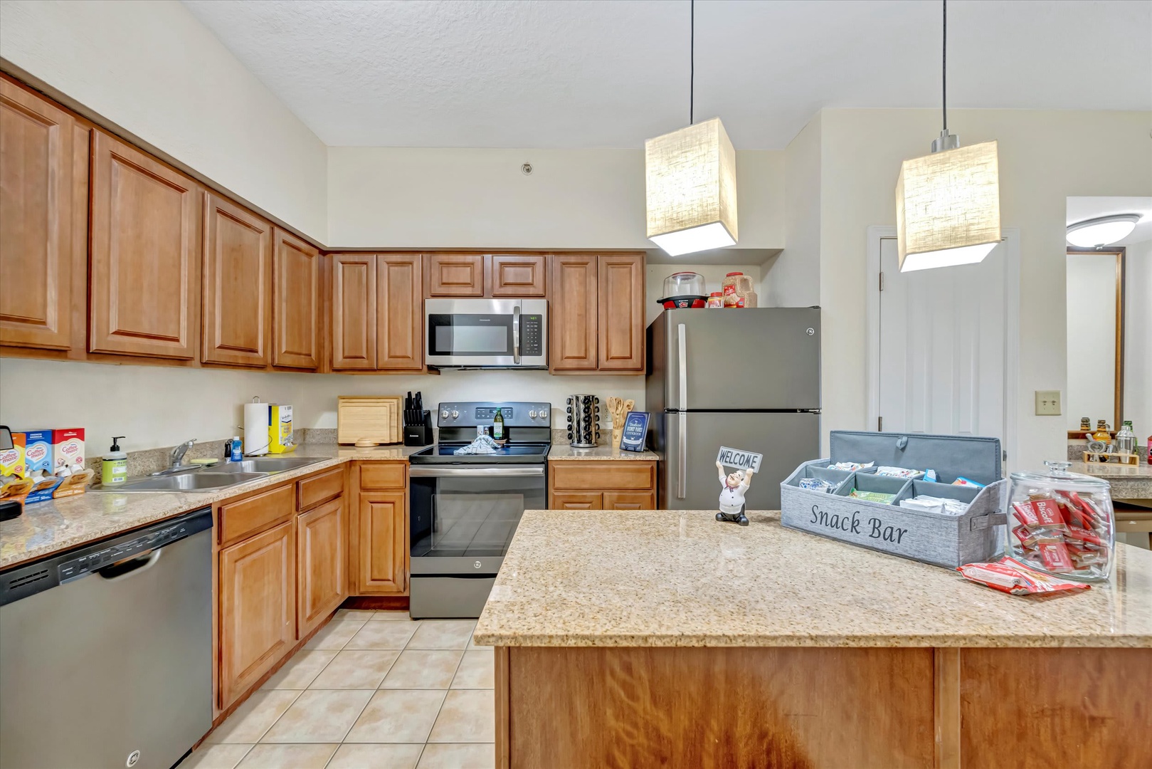 Your fully equipped kitchen makes meal prep a breeze, with modern appliances, plenty of counter space, and a thoughtful snack bar to keep everyone fueled for adventure.