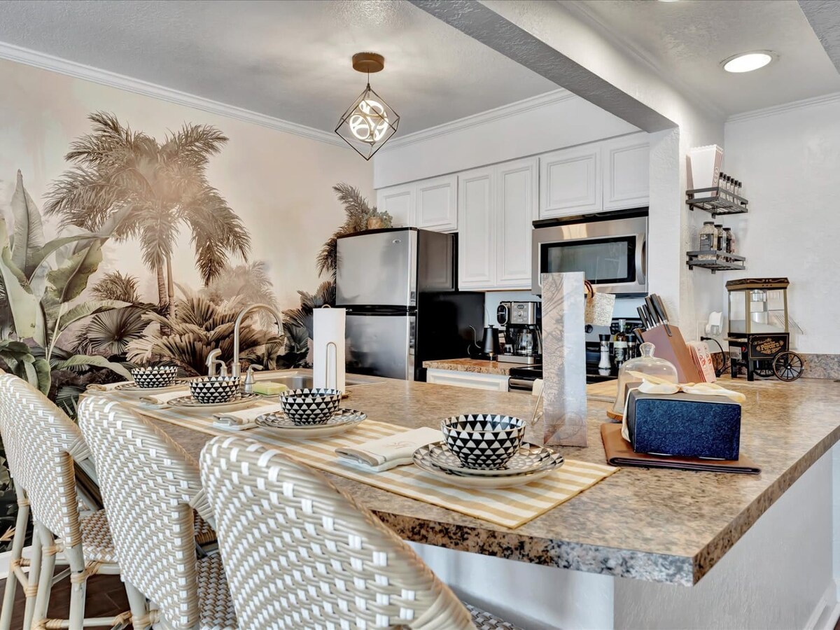 Your stylish kitchen island awaits with seating for four, granite countertops, and everything you need for memorable meals together—from morning coffee to evening cocktails.