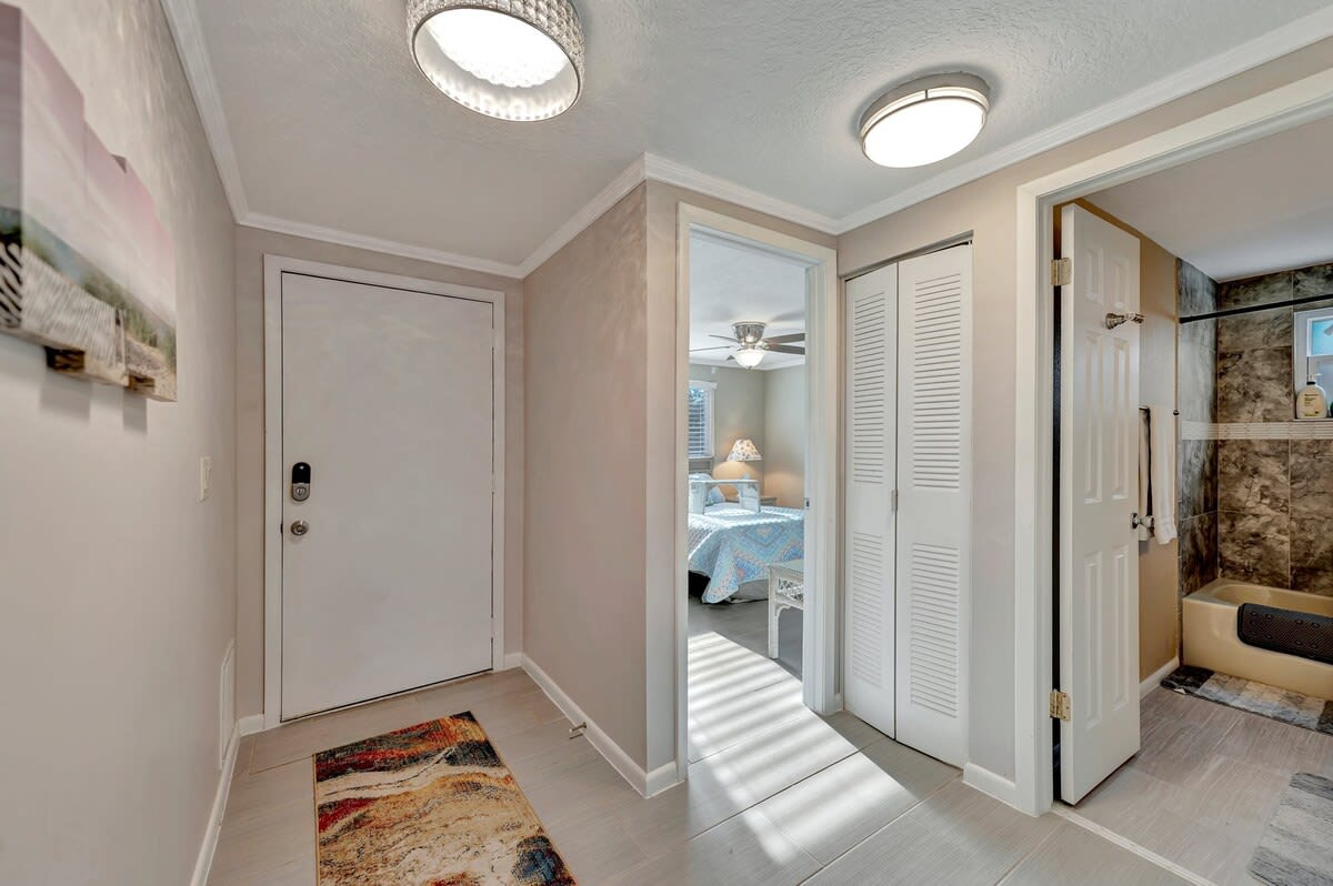 Step into your welcoming retreat, where soft lighting and thoughtful design greet you at the entry. Fresh, clean, and ready for your arrival—your coastal escape begins here.