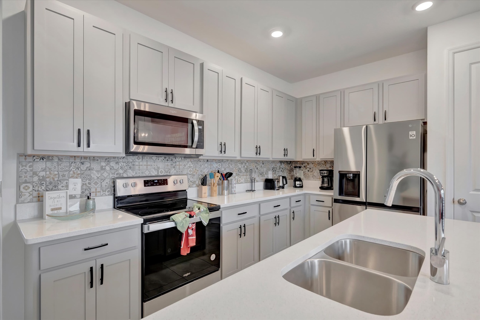 Your fully equipped kitchen awaits, with gleaming countertops, modern appliances, and everything you need to whip up a home-cooked meal or morning coffee. Bright, spacious, and beautifully designed.