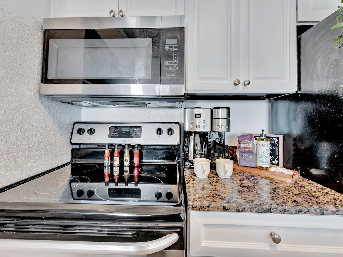 Your fully-equipped kitchen awaits, complete with modern appliances and a fresh coffee station to start your mornings just right.