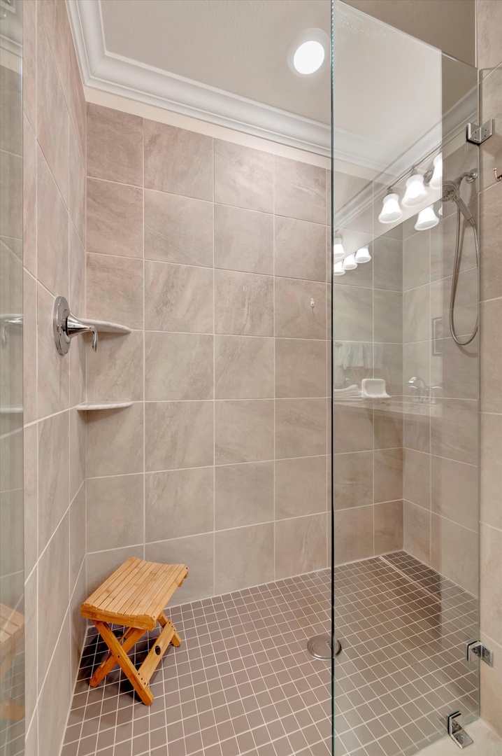 Step into your spa-inspired walk-in shower, where elegant tiled walls and modern fixtures create a calming oasis. The spacious design lets you truly unwind after a day of adventure.
