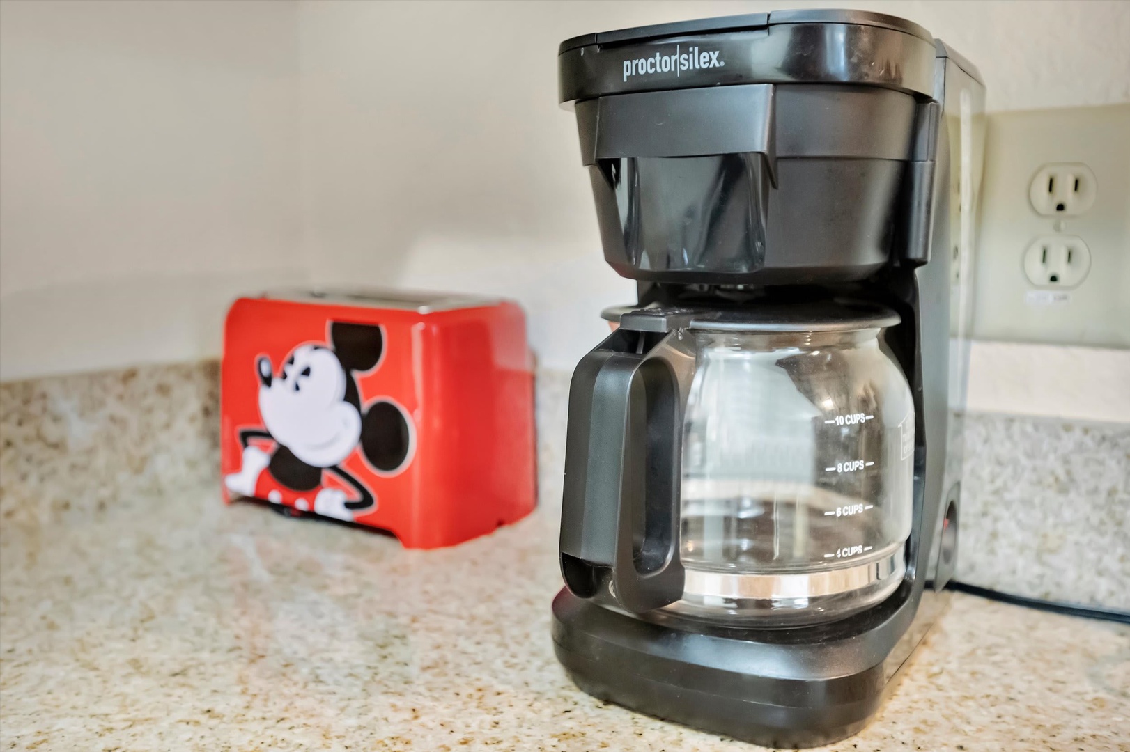 Start your morning right with freshly brewed coffee from your in-room coffee maker, complete with a playful mug to brighten your day.