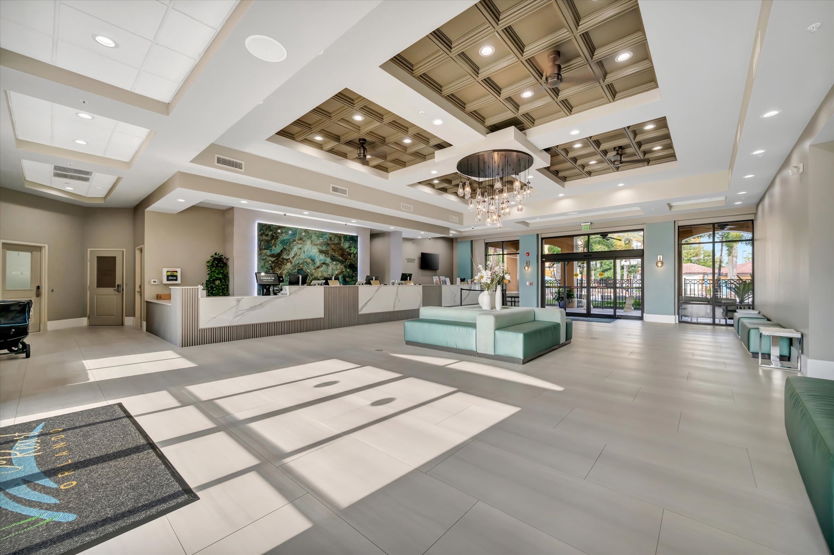 Sunlight streams through the windows into this bright, welcoming lobby, where elegant coffered ceilings and modern design create a relaxing first impression as you arrive.