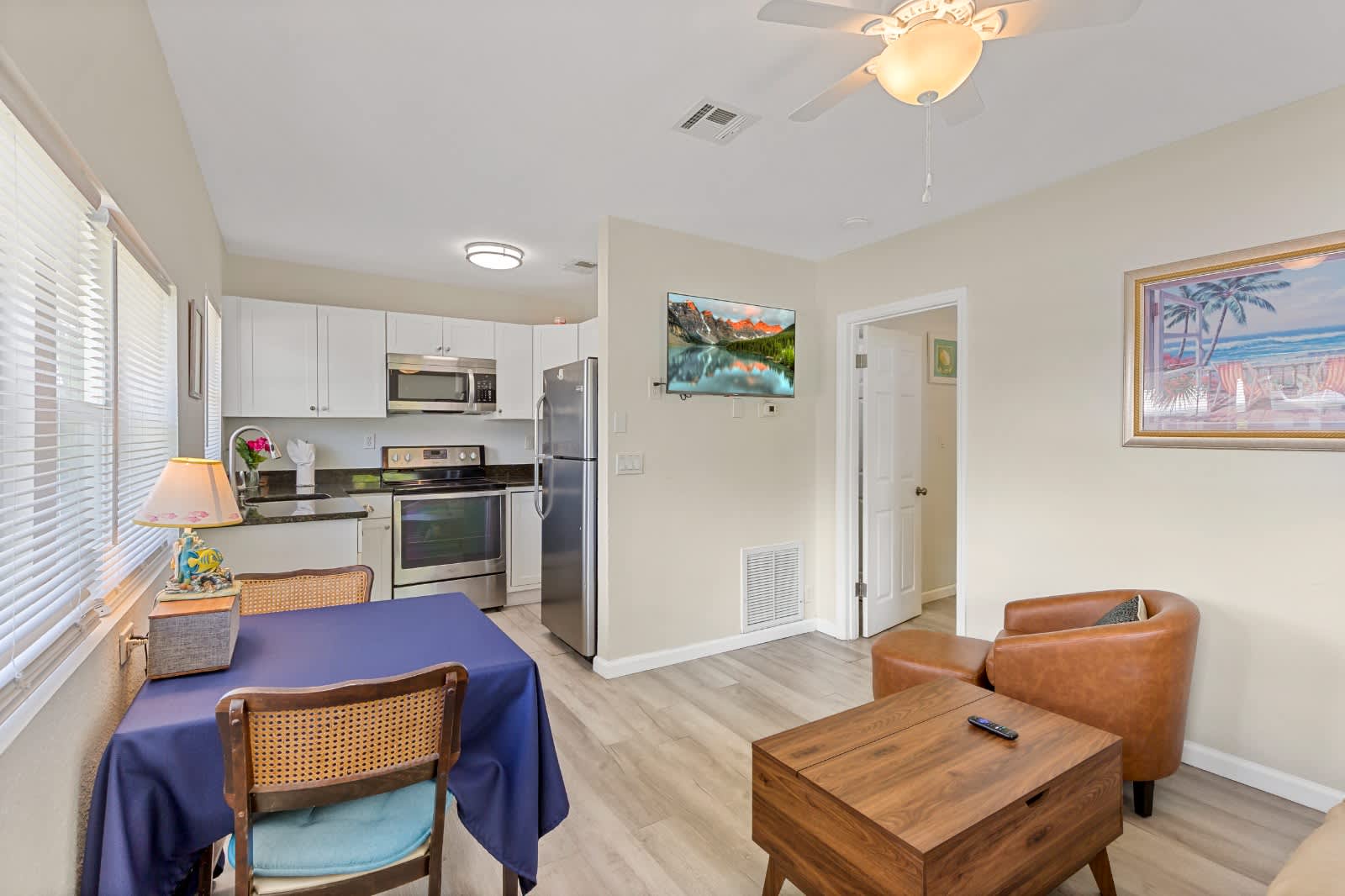 Step into your bright, open living space where modern comfort meets coastal charm. Soft natural light, a fully equipped kitchen, and cozy seating invite you to unwind and feel right at home.