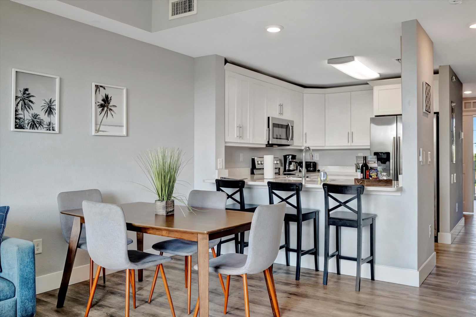 Gather around this inviting open-concept dining and kitchen space where you'll enjoy meals and conversations. The modern kitchen features everything you need for easy meal prep.