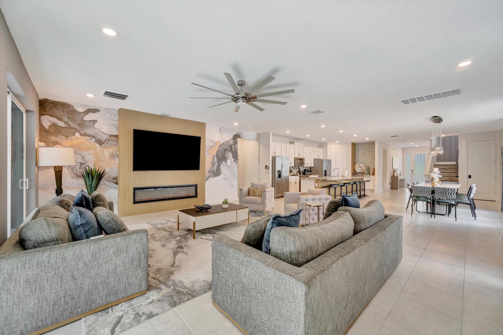 Sink into plush sofas in your spacious, light-filled living area with sleek finishes and an open layout connecting to your dining space and gourmet kitchen—perfect for unwinding or entertaining.