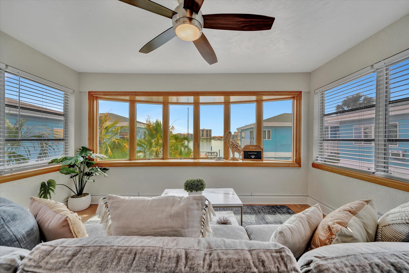 Sink into plush seating and feel the ocean breeze as you unwind in your bright, airy sunroom—your perfect coastal retreat awaits.