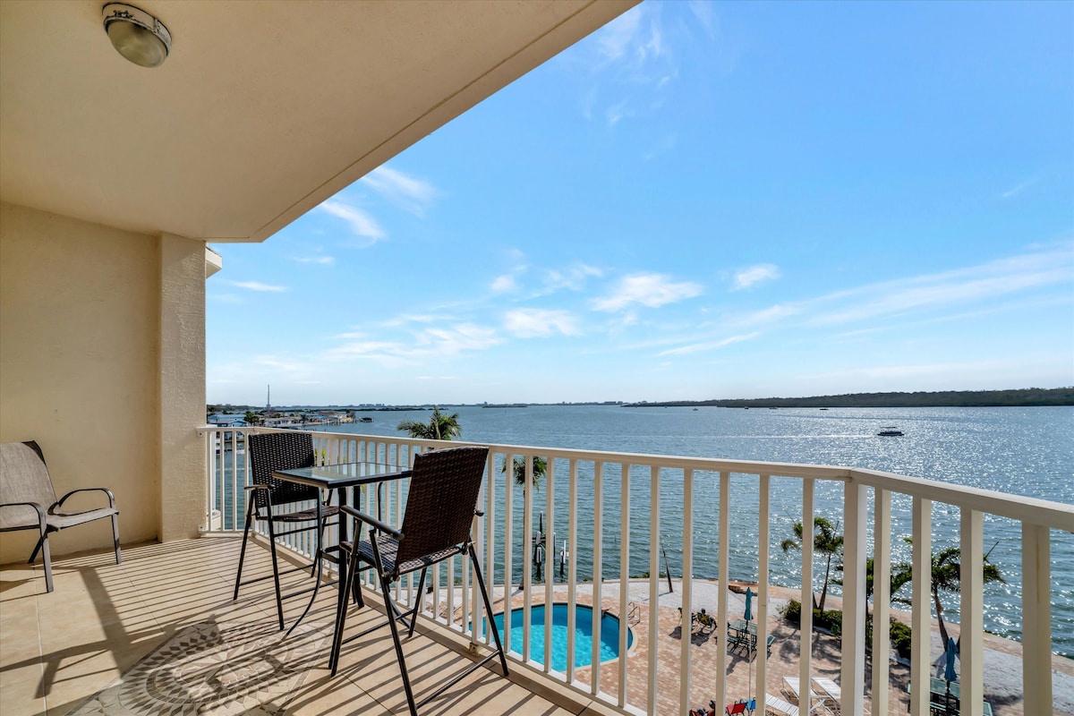 Step onto your private balcony and soak in stunning waterfront views stretching across the bay. Sip morning coffee at your bistro table while enjoying gentle bay breezes and the sparkling water below.
