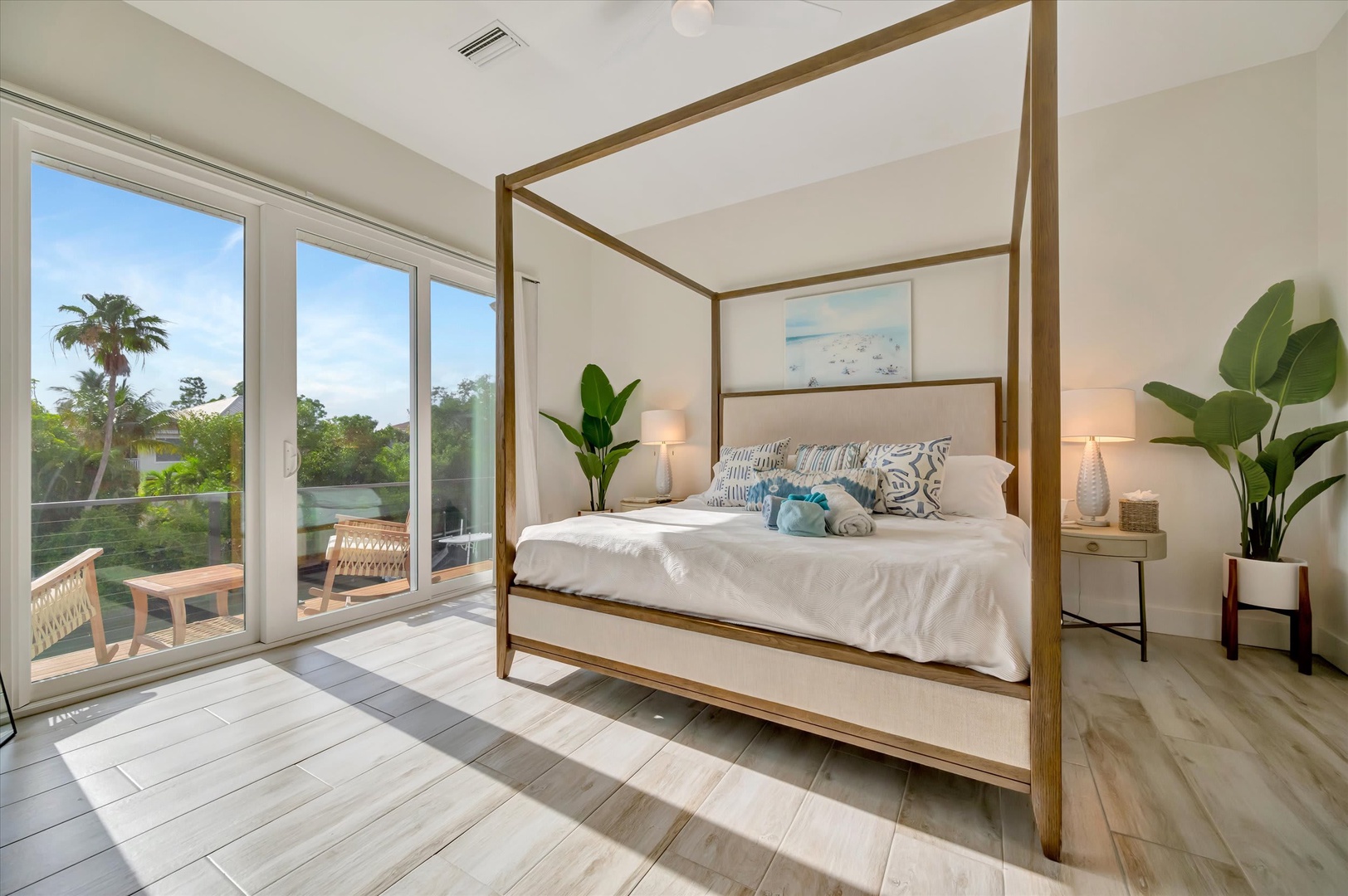Wake up to tropical breezes and waterfront views in your serene bedroom retreat. Step out onto your private balcony and soak in the peaceful surroundings from this airy, light-filled space.