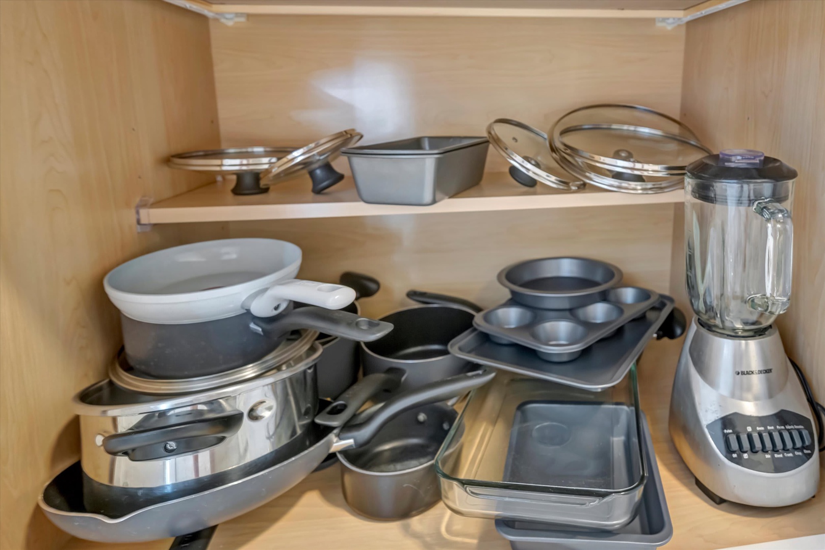 Everything you need to cook is stocked and ready in your kitchen cabinet—pots, pans, baking sheets, and even a blender for morning smoothies.