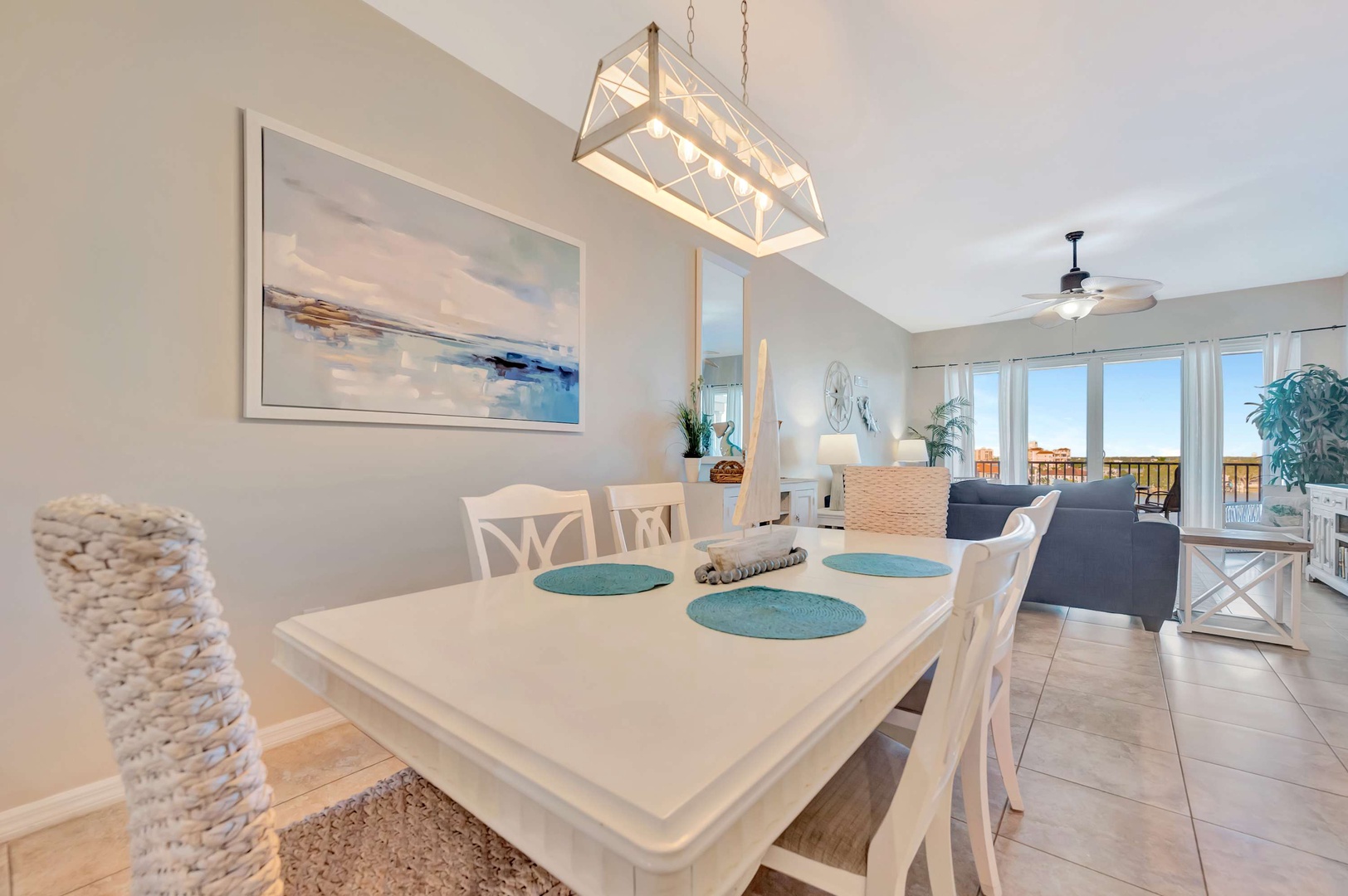 Light-filled spaces flow from your dining area to the living room and out to your private balcony, where natural scenery stretches beyond the glass doors inviting you to unwind in coastal comfort.