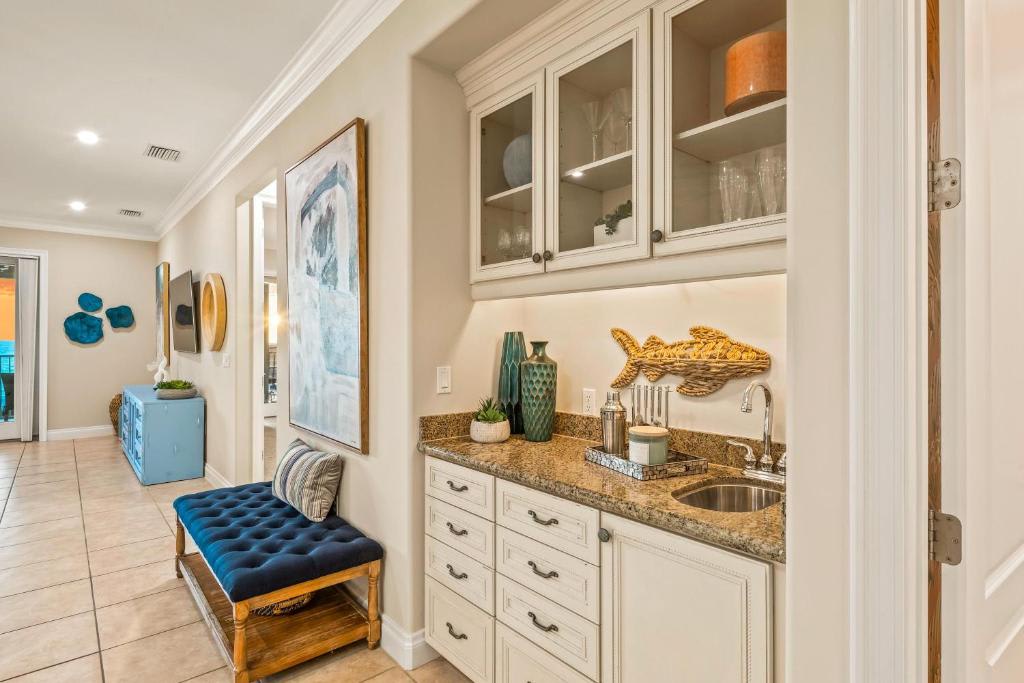 Your private wet bar brings coastal charm right into your space, where you can fix drinks and unwind beneath soft lighting with elegant glassware at hand.