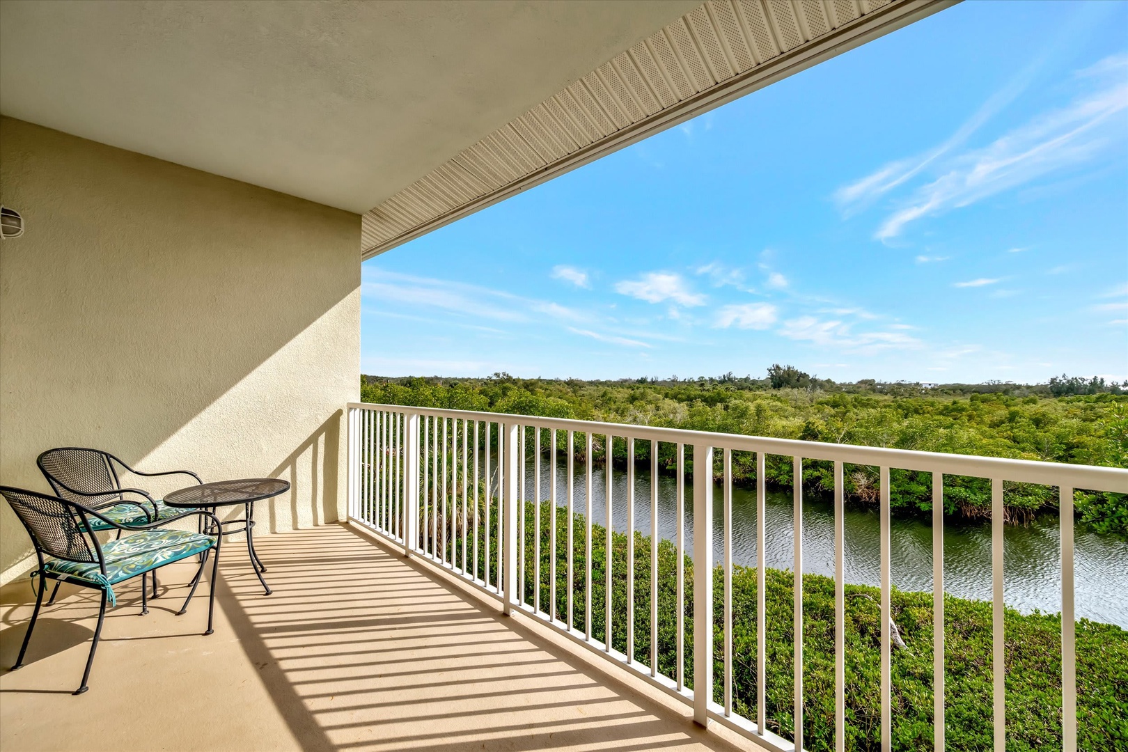 Step onto your private balcony and breathe in the tranquil river view framed by lush mangroves and open sky. Perfect for morning coffee or unwinding with a good book in the gentle Florida breeze.