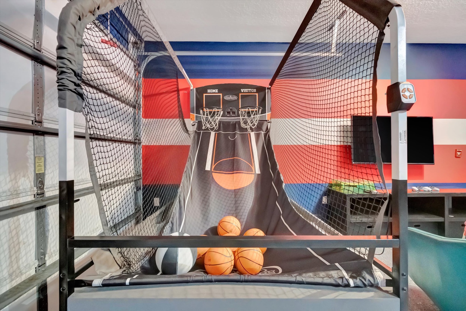 Challenge yourself to a friendly shootout on your own arcade-style basketball game, complete with multiple hoops and a digital scoreboard to track every victory.