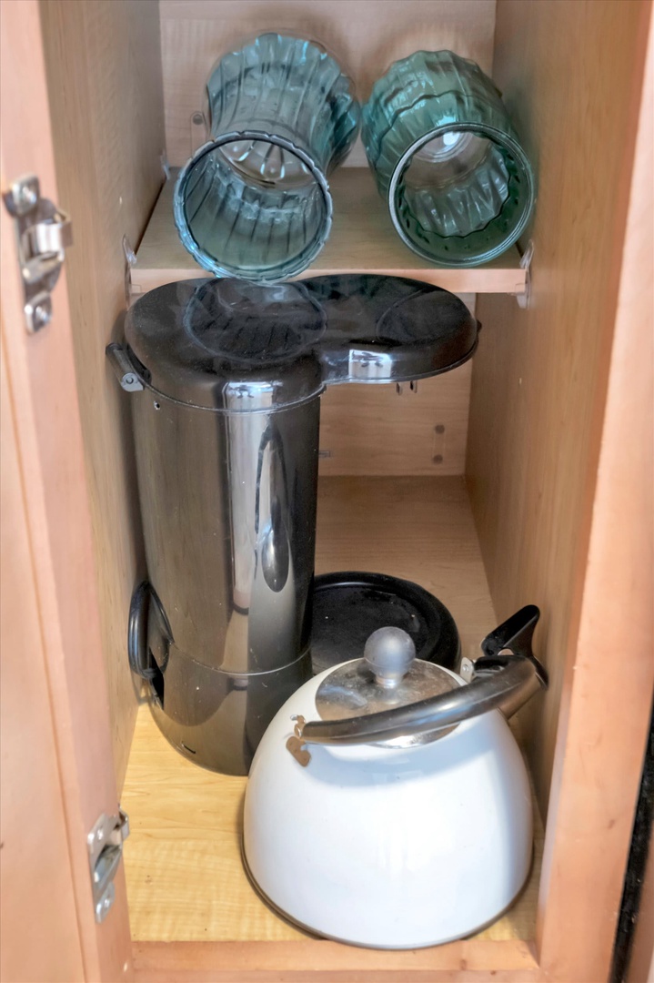 Find everything you need to brew your morning coffee or afternoon tea, neatly organized and ready in this clever cabinet setup.