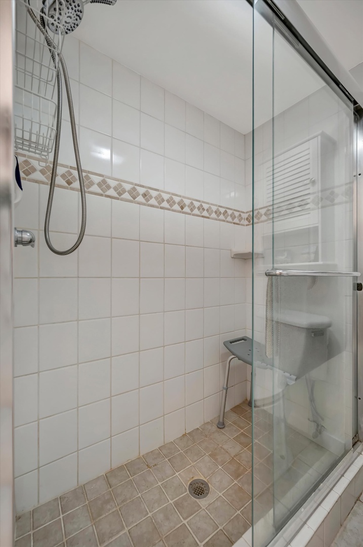 Step into your sparkling clean, tiled walk-in shower with a refreshing rainfall showerhead and convenient handheld option—everything you need for a relaxing rinse after your adventures.