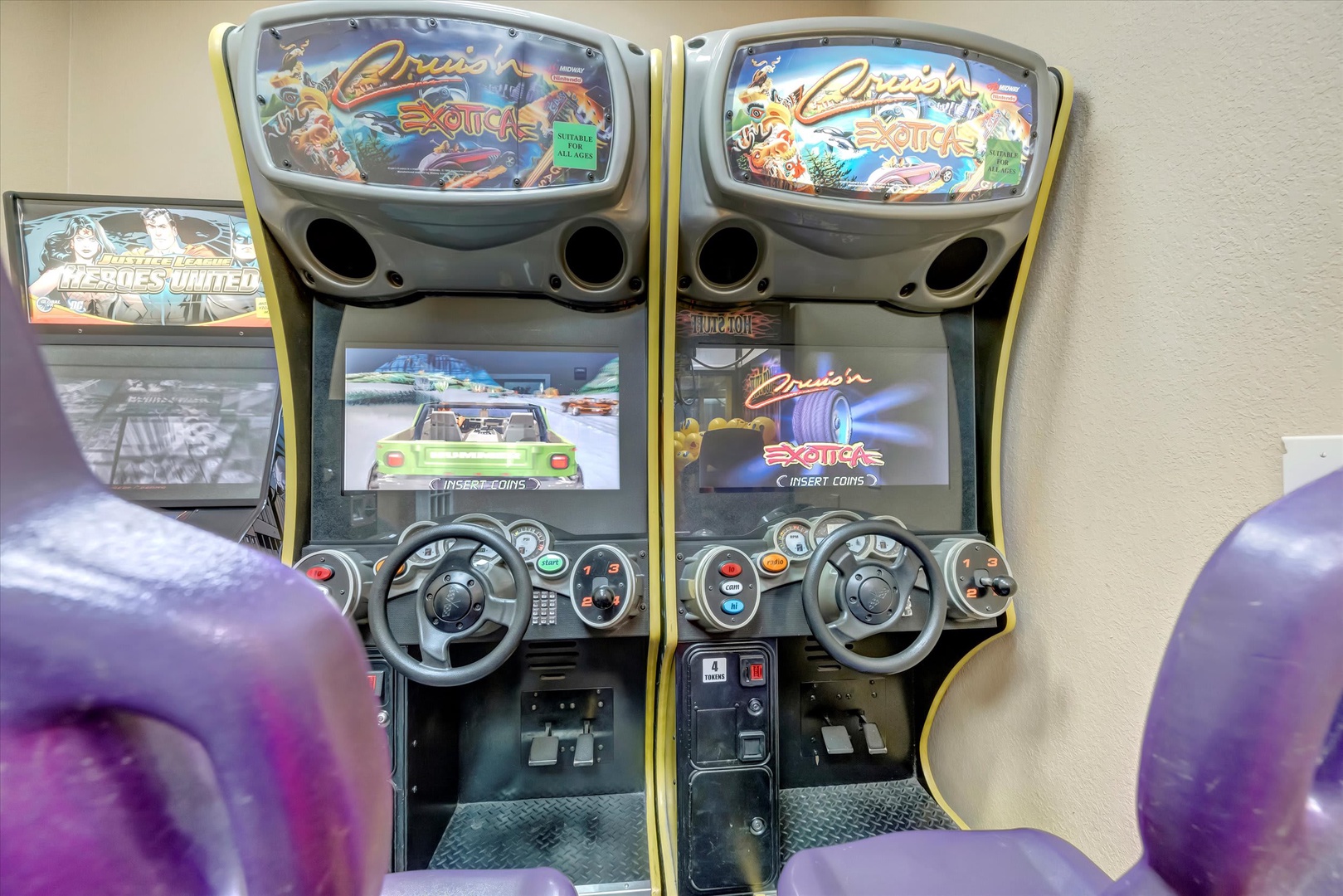 Challenge friends to a racing game in your dedicated arcade area, complete with authentic sit-down racing cabinets and immersive controls.
