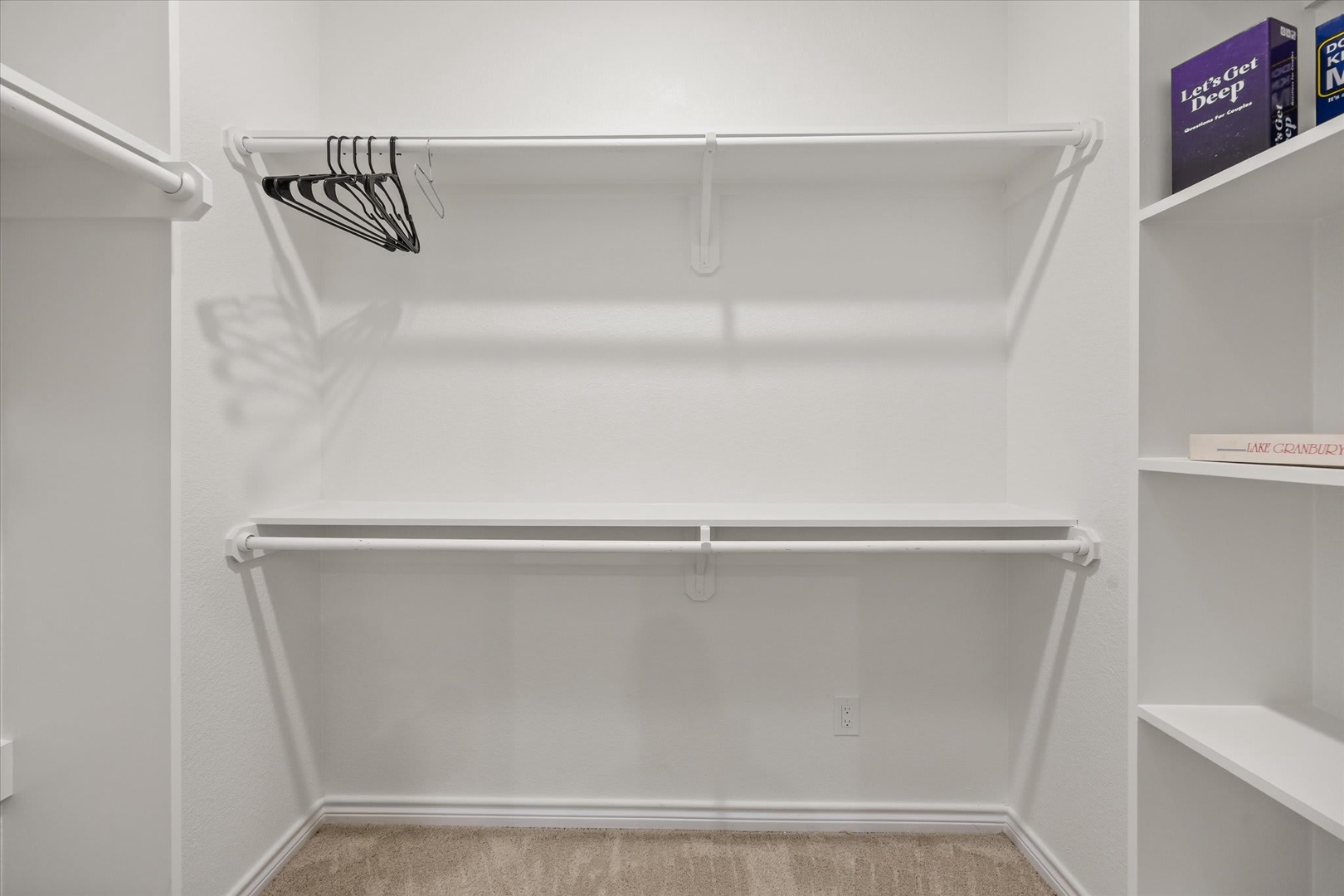 Your spacious walk-in closet features double hanging rods and convenient shelving, giving you plenty of room to organize and settle in comfortably.