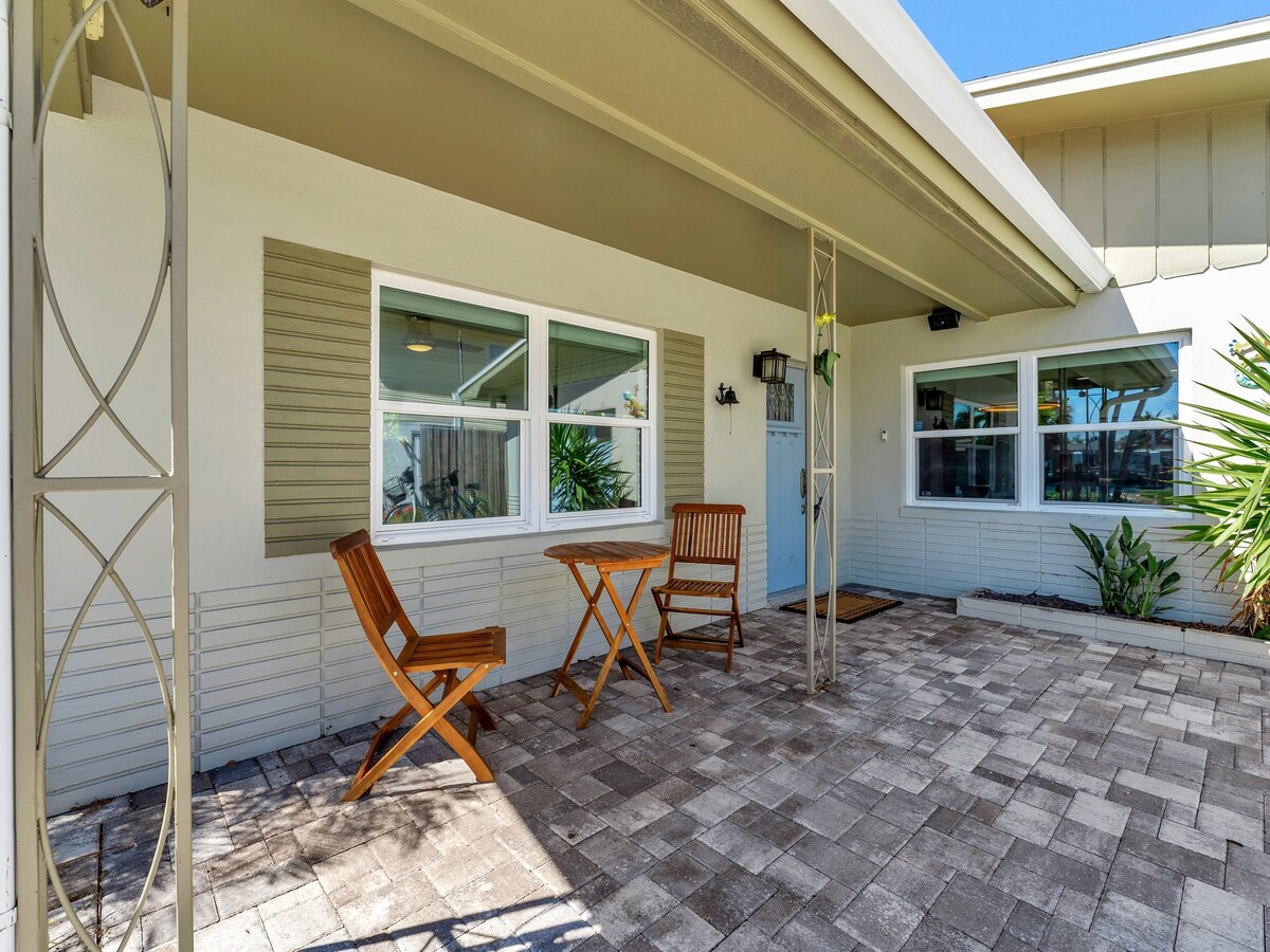A charming coastal entrance welcomes you to your beach getaway, featuring a private patio with teak bistro seating where you can enjoy morning coffee or evening drinks in the Florida sunshine.