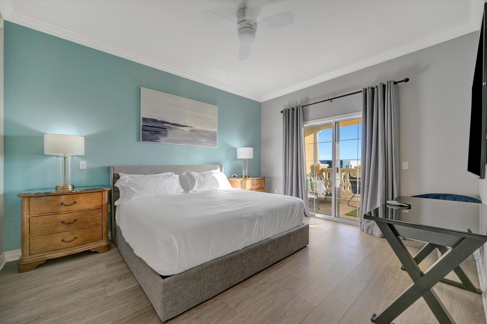 Sink into crisp linens and wake to gentle sea breezes drifting through your private balcony door, where coastal views await just beyond the room.