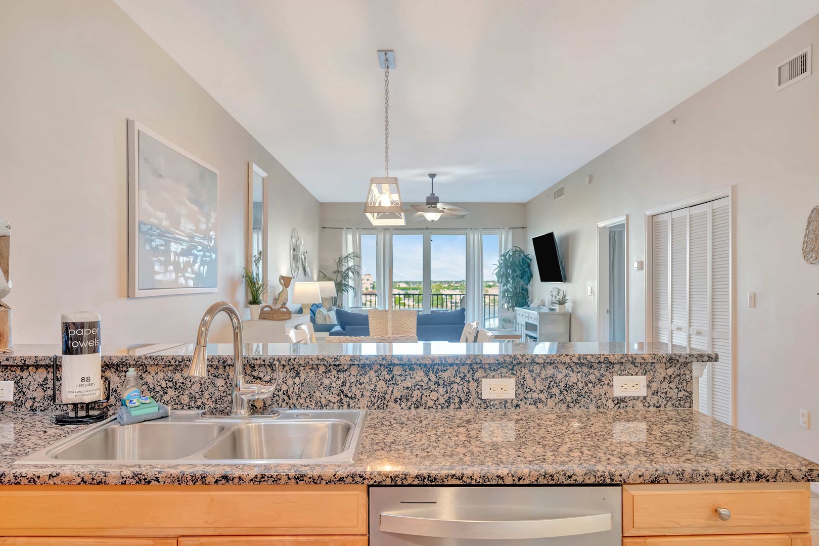 Your open kitchen flows seamlessly into the living area, where natural light and serene views create a bright, welcoming retreat for cooking and relaxing together.