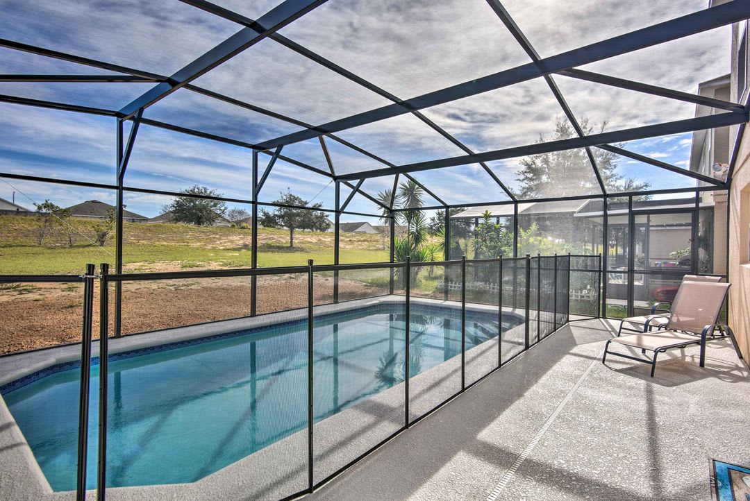 Your private screened pool offers a peaceful retreat with open views of the surrounding landscape, perfect for soaking up the Florida sunshine in complete privacy.