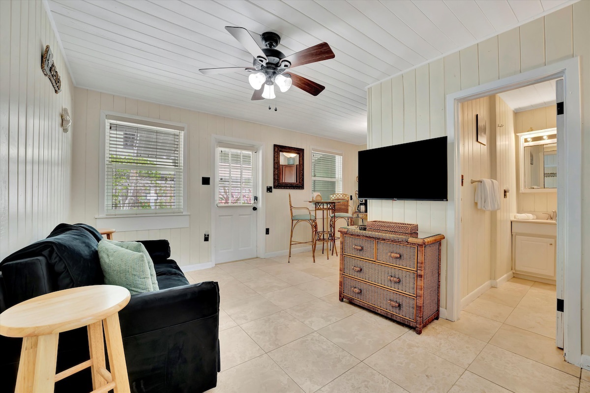 Unwind in your cozy cottage-style retreat with breezy coastal charm. Cool off under the ceiling fan, relax on the plush loveseat, and enjoy streaming your favorite shows—all with cheerful natural light streaming in.