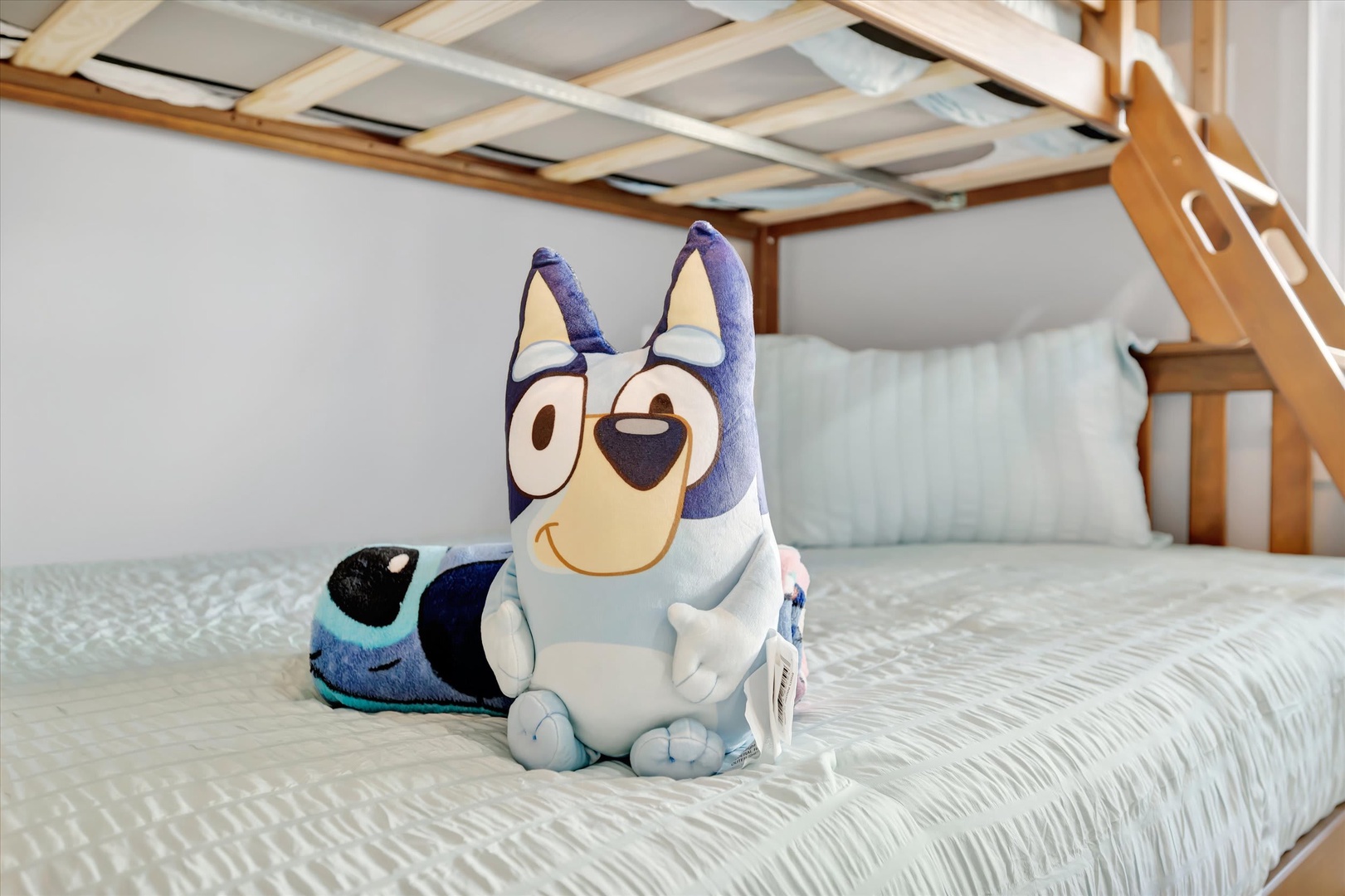 Climb into your cozy loft bed for a restful night—soft linens and a welcoming touch await you in this charming sleeping nook.