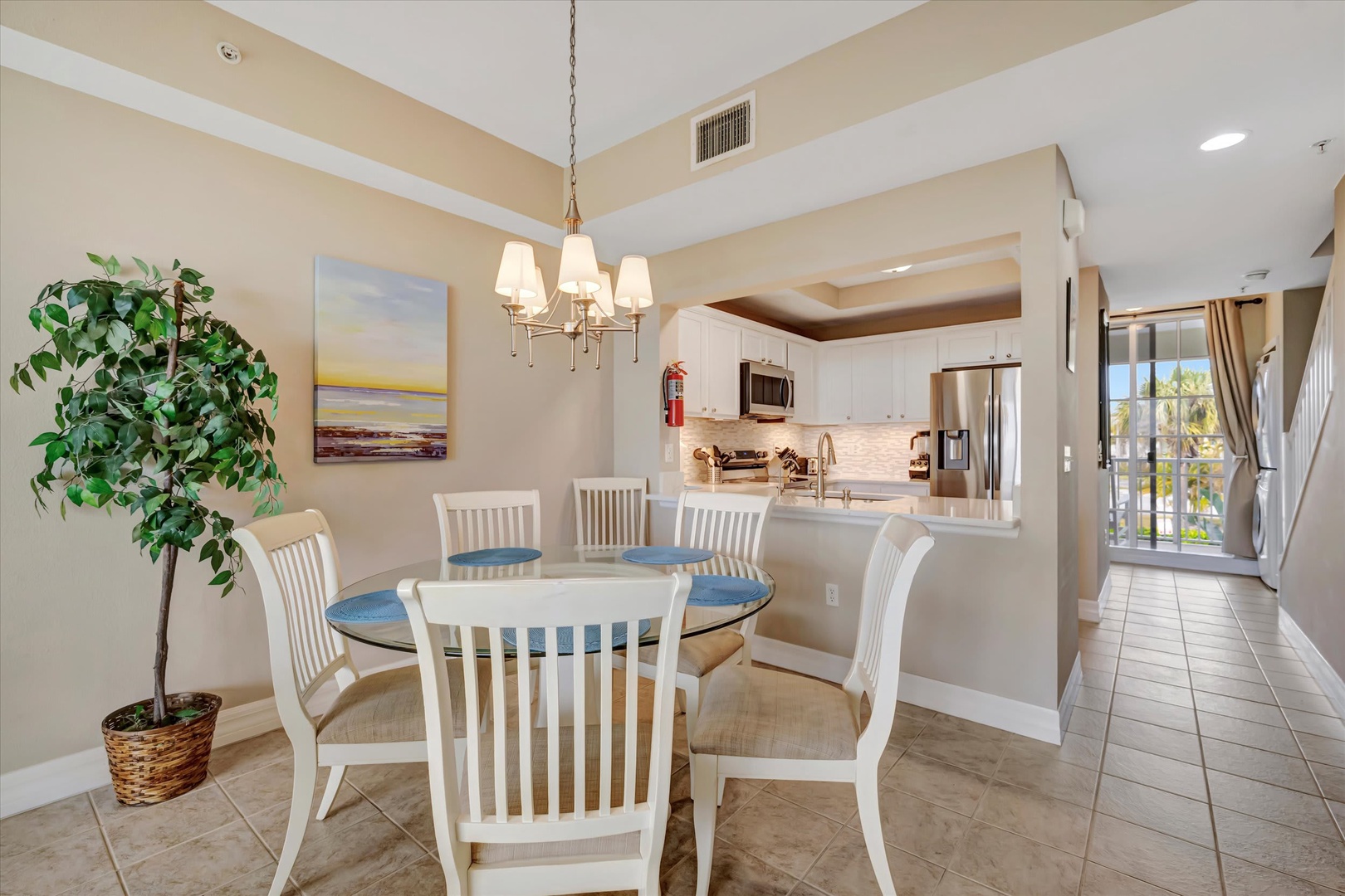 Gather around the bright dining area and open kitchen, where airy vaulted ceilings and abundant natural light make every meal feel special. You'll love the seamless flow and coastal charm welcoming you home.
