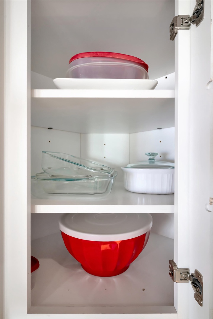 Your kitchen is stocked with fresh dishes and cookware, ready for you to whip up your favorite meals.