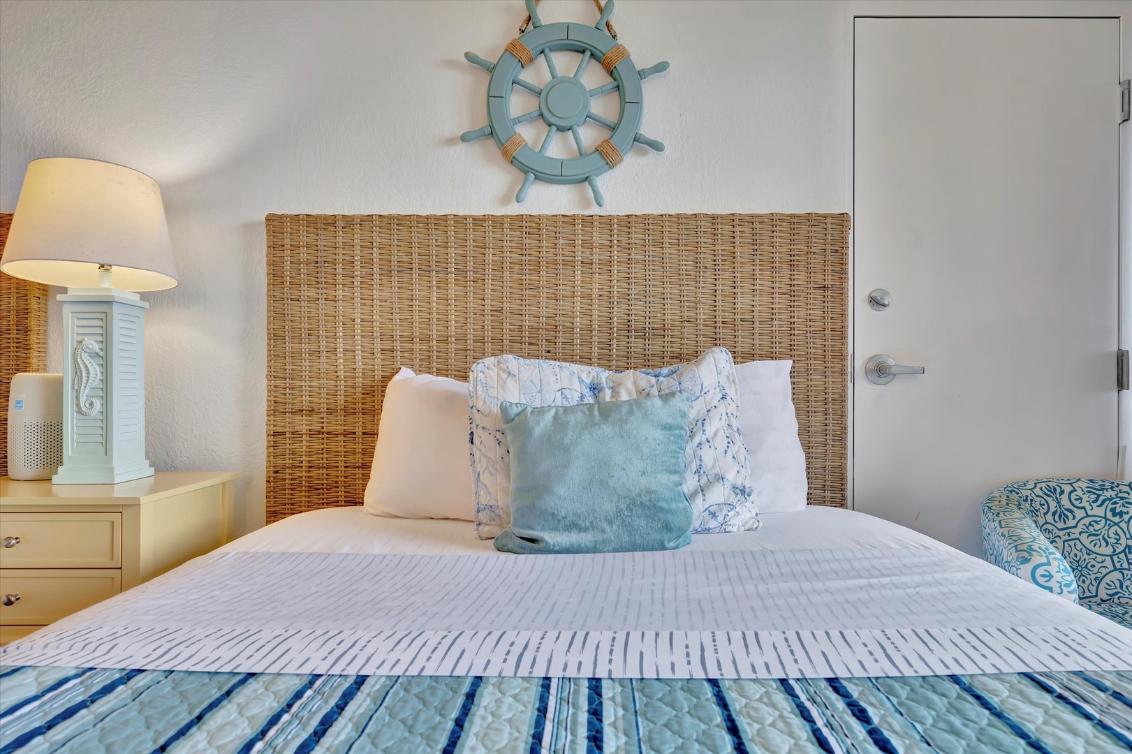 Drift off in this coastal-inspired bedroom, where crisp linens and soft sea blues create your perfect seaside retreat.