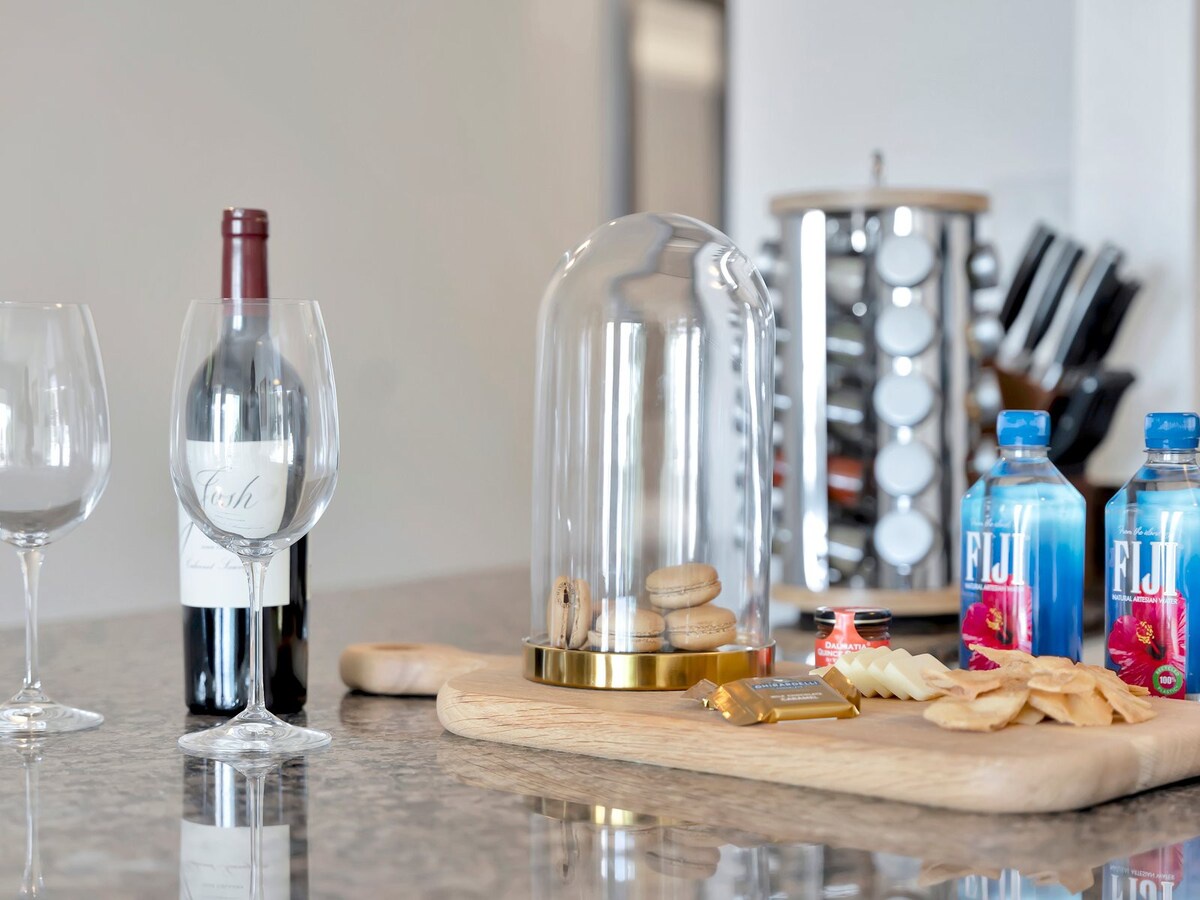 A thoughtfully prepared welcome spread awaits with wine, artisan cheeses, and refreshments—perfect for unwinding after your journey and settling into your home away from home.
