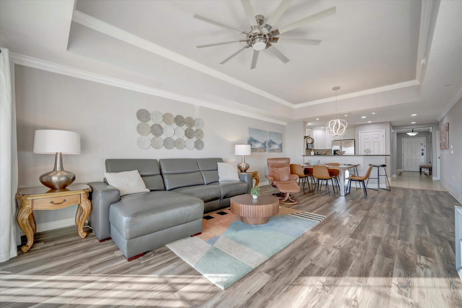 Unwind in your spacious, light-filled living area with open-concept flow into the dining space and kitchen. Modern finishes, plush seating, and thoughtful décor create the perfect retreat after a day of exploring.