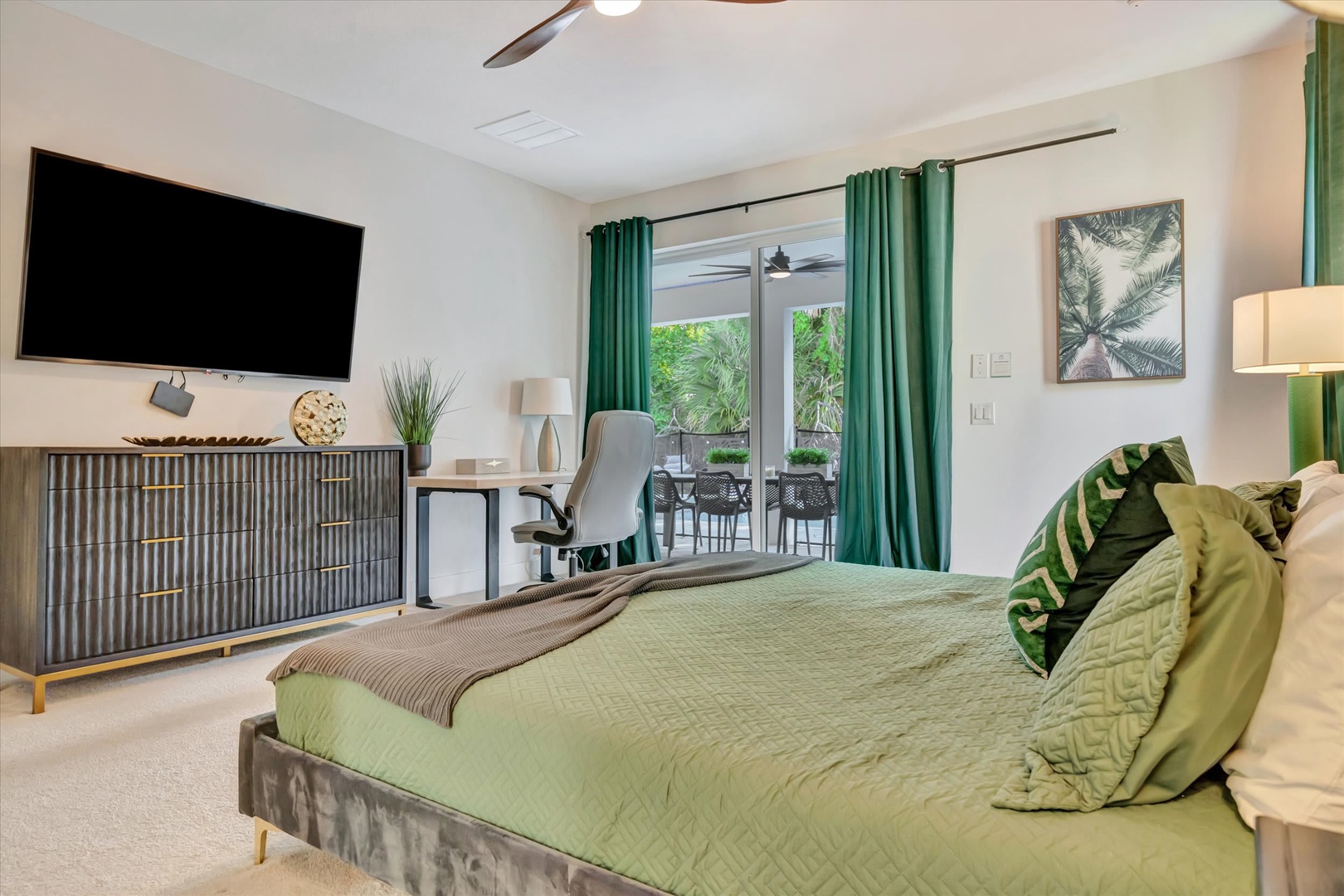Relax in your serene bedroom retreat, styled with tropical accents and a private balcony overlooking lush greenery—the perfect place to unwind after a day of adventure.